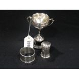 A Silver Two Handled Golf Club Trophy, Together With A Silver Pepper & Serviette Rings