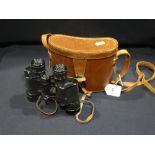 A Pair Of Cased Dollond Binoculars