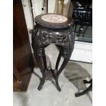An Early 20th Century Oriental Hardwood Jardiniere Stand With Inset Pink Marble Top