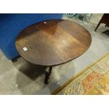 An Antique Oak Tripod Occasional Table