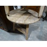 An Antique Pine Cricket Table With Base Shelf