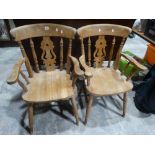 A Pair Of Windsor Style Splat Back Elbow Chairs