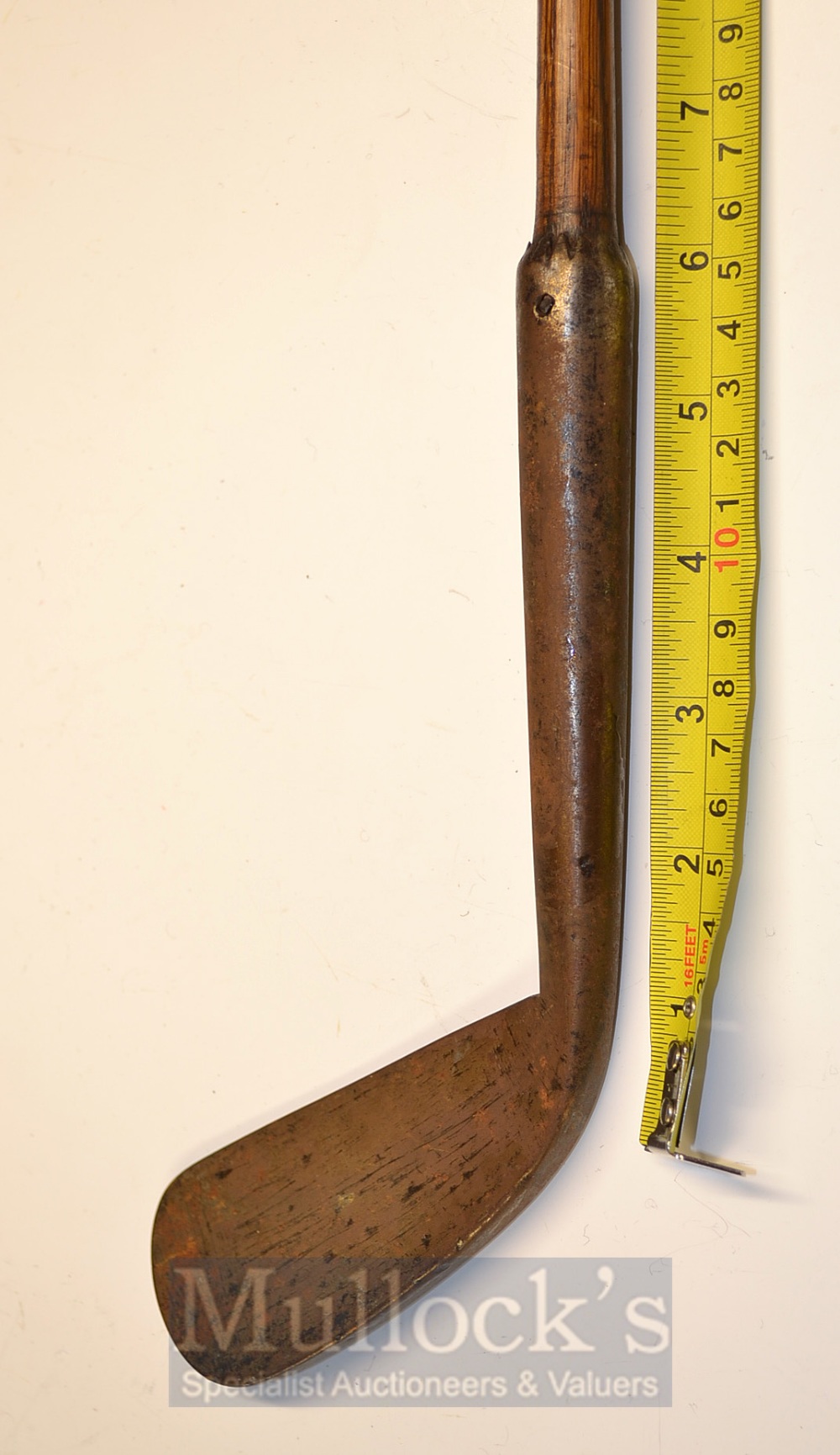 An Early Blacksmiths Made Concave Faced Driving Iron with 6” hosel and heavy deep knurling, the