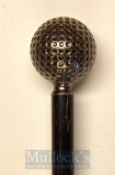 Dimple Golf Ball Head Sunday Golf Walking Stick on a black ebonised shaft with brass tip,