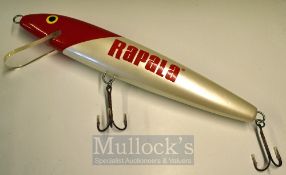 Lure Shop Display: Large Rapala red and silver bait example with 2x large treble hooks – overall