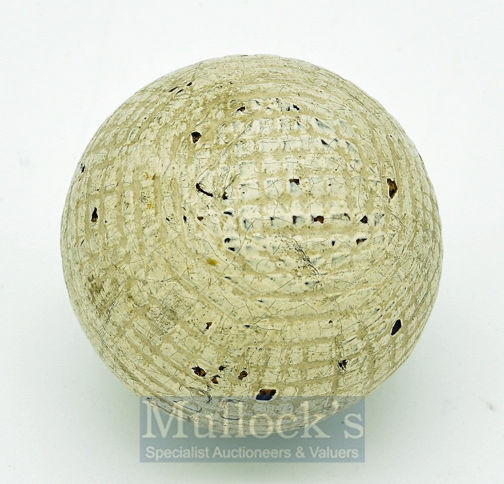 Rare Forgan Hand Hammered Guttie Golf Ball in the fine mesh style retaining 90% of white paint cover