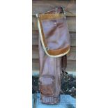Good period leather oval shaped golf bag c/w leather shoulder strap, travel/accessory hood, and ball
