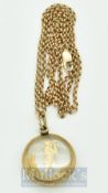 9ct gold Golf Pendant and yellow metal chain – glass and 9ct gold pendant featuring a golfer stamped
