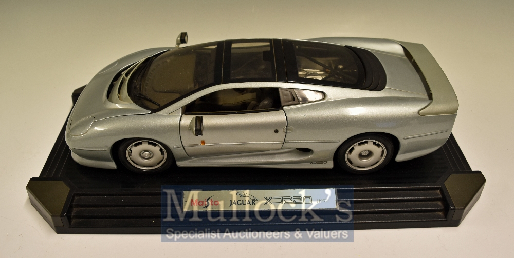 Maisto Jaguar XJ220 Diecast Model Toy: 1:12 Scale 1992 Silver on black plastic base in original box