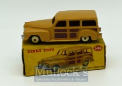 Dinky 344 Plymouth Estate Car Diecast Toy - tan body, brown side panels, beige ridged hubs, silver