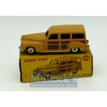 Dinky 344 Plymouth Estate Car Diecast Toy - tan body, brown side panels, beige ridged hubs, silver