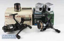 2x Shimano Baitrunner spinning reels – to incl DL 2500 FA spinning reel – c/w 2x spare spools; and