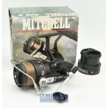Mitchell 300S spinning reel in black with skirted spool^ full bail^ with line^ plus spare spool in