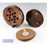 Large Unnamed wood and brass 9 ½” Sea centre pin reel with perforations to centre^ twin handles^