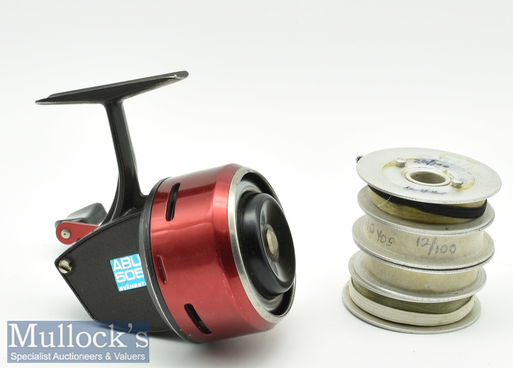 ABU 505 closed face reel in red and black, appears with 4 spare spools, appears in good condition