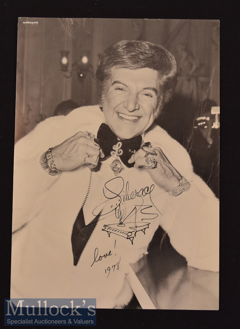 Liberace Signed Photograph a black and white photograph with black ink ‘Liberace love 1978’ with a