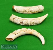 Three Pieces of Carved Tusk depicting an Elephant design on two^ together with Water Buffalo on
