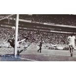 Gordon Banks Signed Football print a b&w print depicts Banks diving for the ball, measures 60x42cm