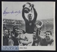 Bobby Moore Signed West Ham United Print depicting Moore holding the FA Cup aloft, signed in blue to