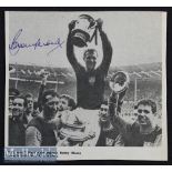 Bobby Moore Signed West Ham United Print depicting Moore holding the FA Cup aloft, signed in blue to