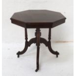 EDWARDIAN MAHOGANY OCTAGONAL OCCASIONAL TABLE with a turned central column and four outer columns,