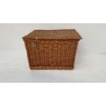 WICKER PICNIC HAMPER with a lift lid revealing a fitted interior for six bottles and a storage area,