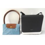 TWO NEW DESIGNER BAGS comprising a Longchamp Le Pliage folding shopping tote in arctic blue; and a