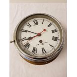 SMITHS PORTHOLE STYLE CLOCK with circular enamel dial, Roman numerals and 30 hour movement, with