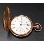 NINE CARAT GOLD CASED WALTHAM POCKET WATCH the white enamel dial with Arabic numerals and subsidiary