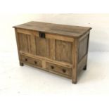ANTIQUE OAK COFFER with a moulded top above a fall front with two panelled drawers below, standing