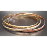 THREE TONE NINE CARAT GOLD RUSSIAN WEDDING STYLE TRIPLE BANGLE the interlinking bangles in rose,