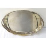LARGE SILVER PLATED OVAL TRAY with a wavy rim and pierced handles, raised on squat feet, 50.5cm long