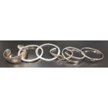 SIX SILVER BANGLES including a twist example and another with wave design (6)