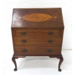 MAHOGANY BUREAU with a crossbanded fall flap opening to reveal a fitted interior above three long