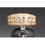 MULTI DIAMOND SET RING the central row of seven diamonds totalling approximately 0.6cts, with a