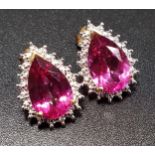 PAIR OF PINK TOPAZ AND DIAMOND EARRINGS the pear cut pink topaz on each within illusion setting with