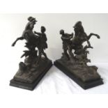 TWO SPELTER FIGURINES each depicting a man trying to control a rearing horse, raised on ebonised