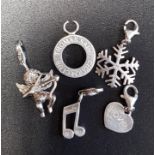 FOUR THOMAS SABO SILVER CHARMS comprising a snowflake, a cherub, a musical note and a heart;