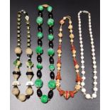 FOUR VINTAGE BEAD NECKLACES comprising a jade coloured hardstone and black agate example, a