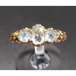 GRADUATED AQUAMARINE THREE STONE RING on nine carat gold shank, ring size P