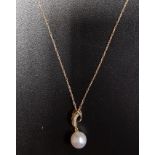 PEARL AND DIAMOND PENDANT the pearl drop suspended from diamond set shaped setting, in nine carat
