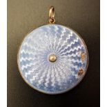 ENAMEL DECORATED CIRCULAR LOCKET PENDANT one side with glazed panel, the other with light blue