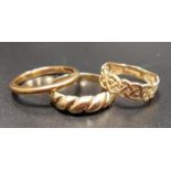 THREE NINE CARAT GOLD RINGS one with pierced Celtic knot decoration, total weight approximately 4.