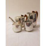 PICQUOT WARE FOUR PIECE TEA SET comprising a tea pot, hot water jug, lidded sugar bowl and a milk
