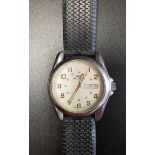 GENTLEMAN'S SWISS MILITARY WRISTWATCH the cream guilloche enamel dial with Arabic numerals and day