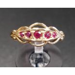 GRADUATED RUBY FIVE STONE RING in attractive pierced setting, on nine carat gold shank, ring size