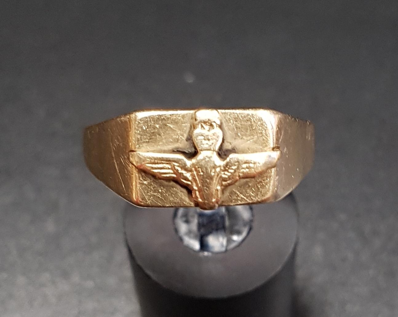 NINE CARAT GOLD RING with raised decoration of wings surmounted by a crown, ring size V and - Image 2 of 2