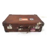 VINTAGE LEATHER SUITCASE with reinforced corners and vintage Cunard Line travel labels, 66.5cm wide
