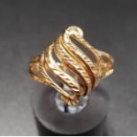 TEN CARAT GOLD RING with pierced scroll detail, ring size N
