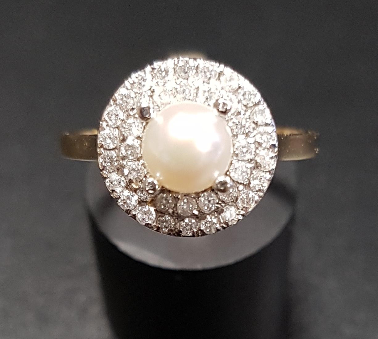 PEARL AND DIAMOND CLUSTER RING the central pearl in double diamond surround totalling